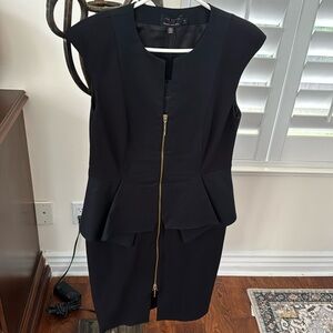 Dress never worn Ted Baker black dress with gold zipper.  Peplum lined